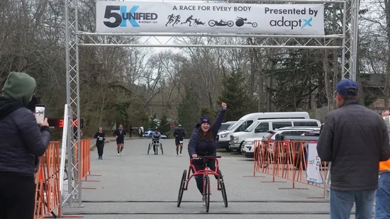 A runner crossing the Hyannis finish line