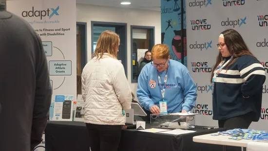 Volunteers at the AdaptX and Move United registration table