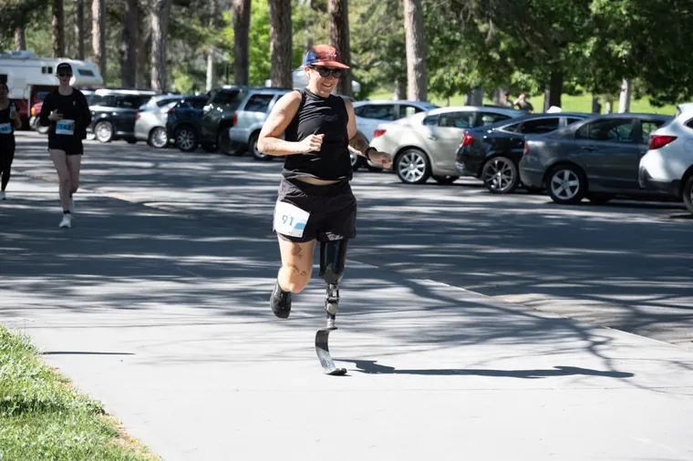 A runner on a blade prosthesis on the open road